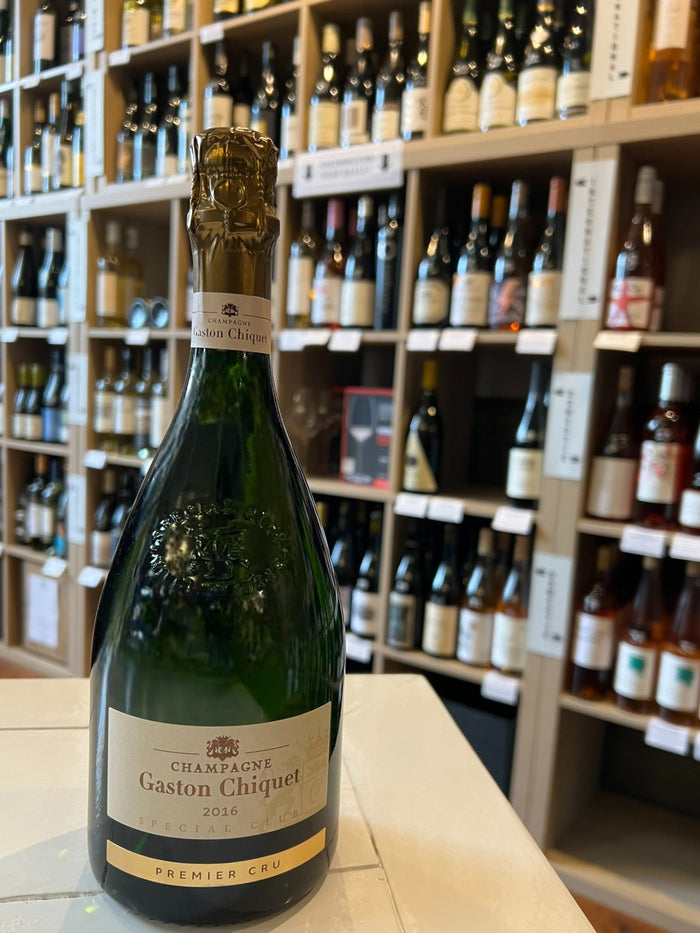 A bottle of GASTON CHIQUET SPECIAL CLUB 2016 by WINE: A-VIN-GARDE/BORDEAUX FINE & RARE, featuring gold foil on the neck and a cream "Premier Cru" label, is photographed against a white background.