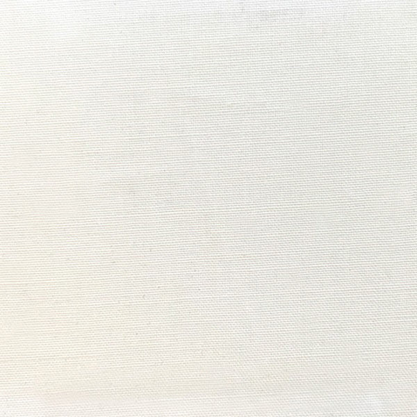 Close-up of a neutral beige textured fabric with a fine, even weave. This smooth and uniform material is perfect for creating the MEIMEIJ - PLEATED ASYMMETRICAL TOP with its sleek sleeveless silhouette and distinctive peplum hem, suitable for diverse textile applications.