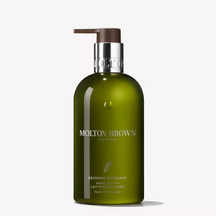 A green 300ml MOLTON BROWN Reviving Rosemary Hand Lotion bottle, featuring a silver label and brown pump, is shown against a plain white background.