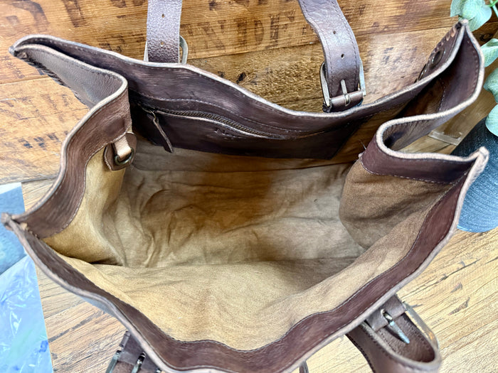 Leather tote bag open top with brown fabric lining and side panel seams
