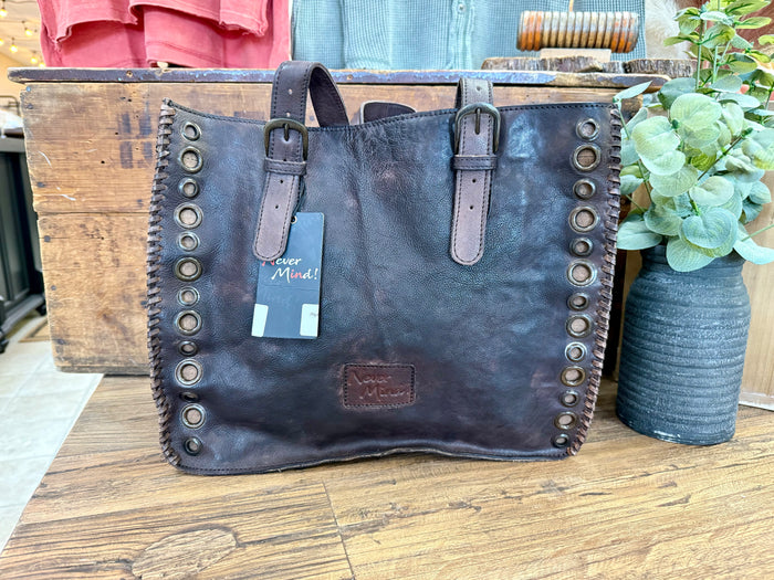 Grommeted leather tote bag with front logo patch and metal eyelet trim