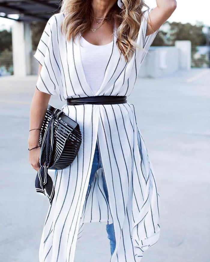 The ADA - SKINNY WRAP BELT by ADA, made from genuine Argentinian leather with a simple twisted design, is coiled into a circle on a plain white background.