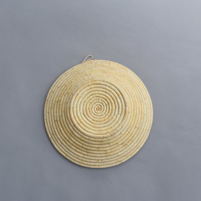 Hand woven straw. A tradition and art which has been part of Ugandan culture for centuries.  With all of the materials used being natural products or recycled, we also believe this is a lovely way of making use of natural resources the world has to offer and making positive changes to become more sustainable.  Beautifully, unique, handmade basket made out of banana stalks and raffia fibres also known as the Ugandan basket.