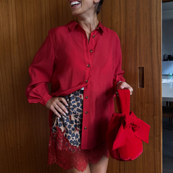 Cherry Red Miley Shirt with blouson sleeves and tortoise buttons, paired with a leopard print lace skirt.