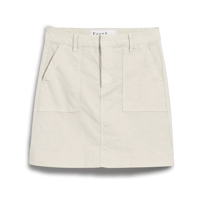 The FRANK & EILEEN Jameson Utility Skirt in Cement is a light beige, knee-length skirt with belt loops, large utility pockets, and a front seam detail, crafted from Italian Performance Linen and shown against a white background.
