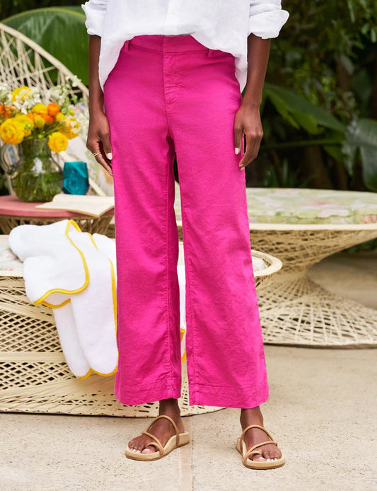 The FRANK & EILEEN Wexford Wide Leg Linen Pant in Guava features a bright pink hue, belt loops, and a concealed front closure, shown laid flat on a white background.
