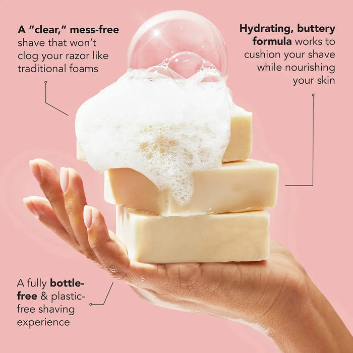 A KITSCH - Shave Butter Bar rests on a marble block, promising the smoothest shave. The packaging emphasizes "All Natural," "pH Balanced," and "Vegan." Below are rosemary, argan nuts, and shea butter, highlighting its plastic-free shaving commitment.
