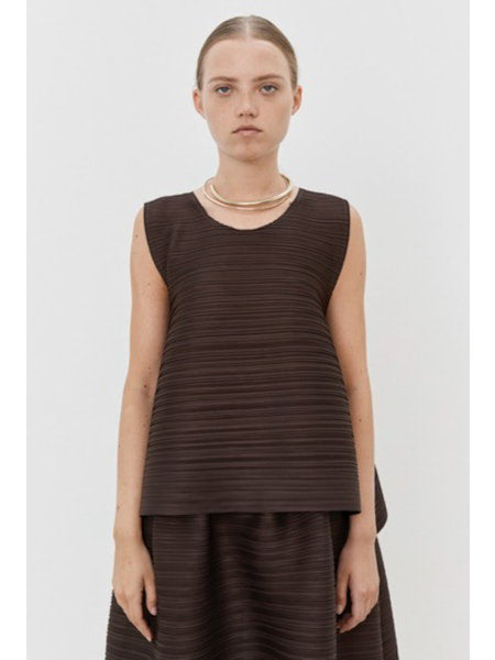 Close-up of MEIMEIJ Plisse Sleeveless Top's dark textured fabric displays a finely woven pattern. The consistent monochrome color and texture, with subtle weave variations, reflect minimalist elegance.