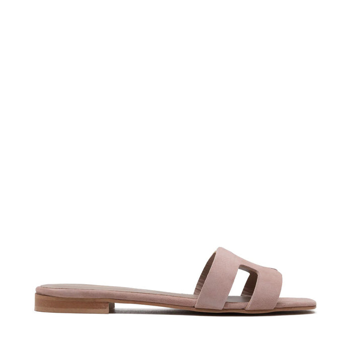 The MICHELE LOPRIORE - H SLIDE is a brown leather sandal with two wide straps, including one with a rectangular cutout, featuring a flat wooden sole. Made in Italy by MICHELE LOPRIORE, it's shown on a white background.
