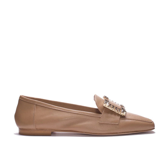 The MICHELE LOPRIORE - MARZIA LOAFER is an elegant flat crafted in Italy from tan genuine leather, featuring a low heel and a large decorative buckle embellished with sparkling crystals on the upper front.
