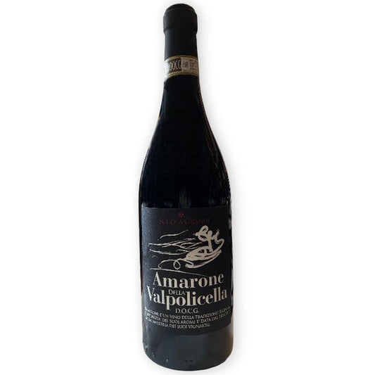 A bottle of SCUOLA GRANDE AMARONE 2020 by WINE: FREEDOM BEVERAGE, Veneto wine made with appassimento. The black label with white text and a gondola is shown upright against a white background.