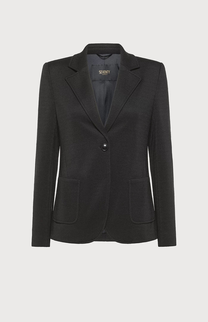 The SEVENTY - SINGLE BREASTED KNIT JACKET by the brand SEVENTY is a tailored women's jacket in black, featuring classic lapels, a single-button closure, and two front pockets. It has a sleek, fitted design and a minimalist, professional appearance. The interior is lined with the "SEVENTY" label visible inside.