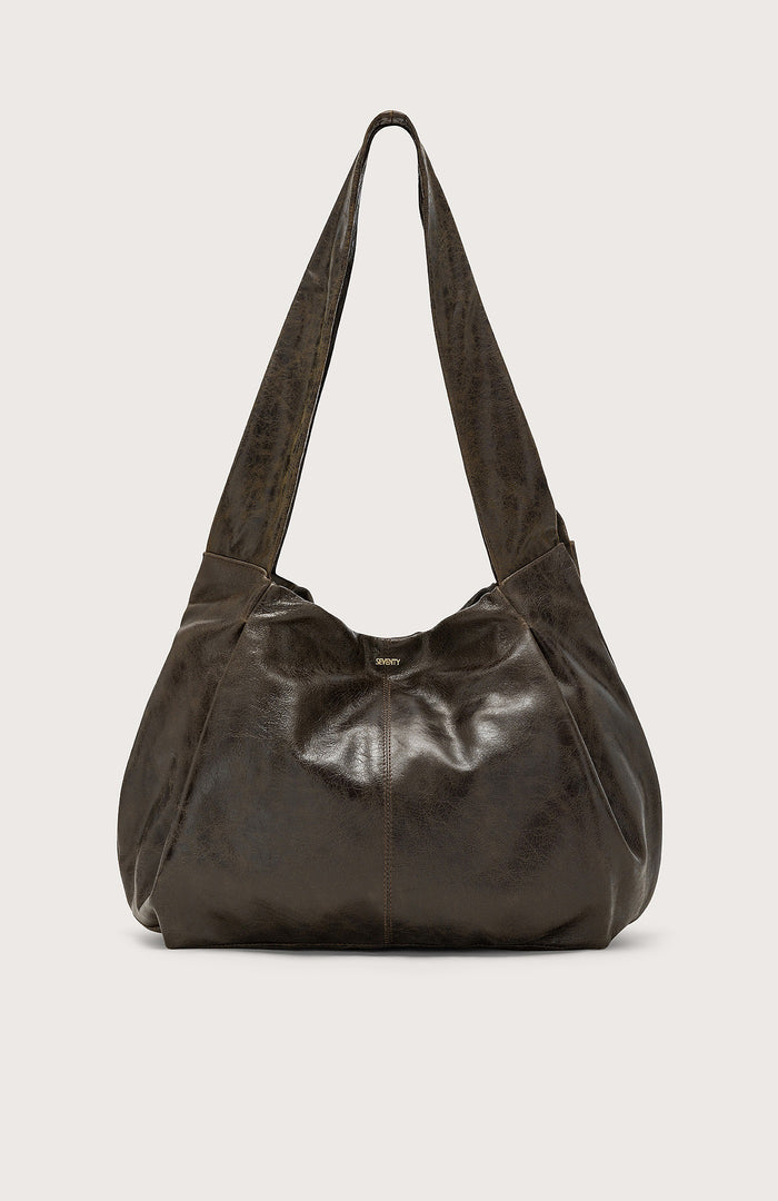 The SEVENTY VENEZIA Slouchy Leather Hobo Bag by SEVENTY features a dark brown, slouchy silhouette in glossy Italian leather with a wide strap, shown against a plain light background.