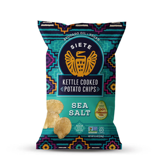 A bag of SIETE FOODS SIETE - SEA SALT KETTLE CHIPS, featuring a vibrant geometric design and eagle logo. These vegan chips are cooked in 100% avocado oil for a crunchy, flavorful snack.