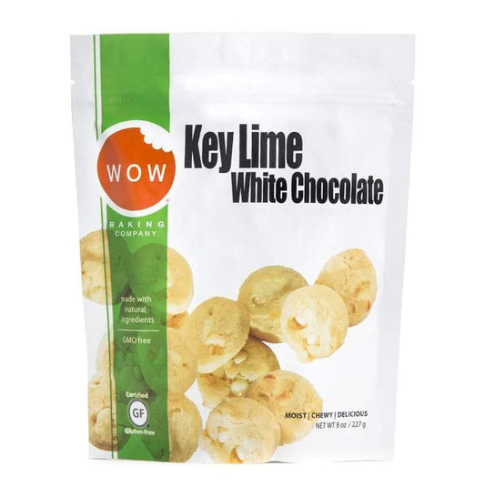 A WOW BAKING COMPANY GLUTEN FREE KEY LIME WHITE CHOCOLATE COOKIE POUCH, featuring cookie images on the front. Packaging highlights gluten free, GMO-free, and natural ingredients.